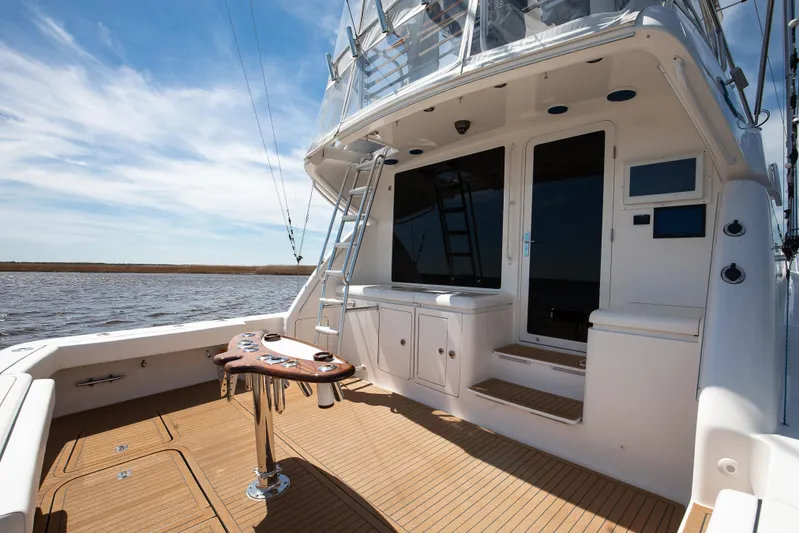Dock Side Yacht Photos Pics 2007 Bertram 570 Convertible yacht deck with fishing setup and ocean view.