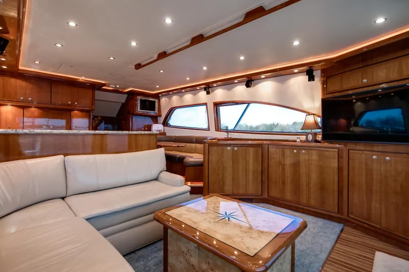 Dock Side Yacht Photos Pics Luxurious interior of a 2007 Bertram 570 Convertible yacht with elegant wood finishes.