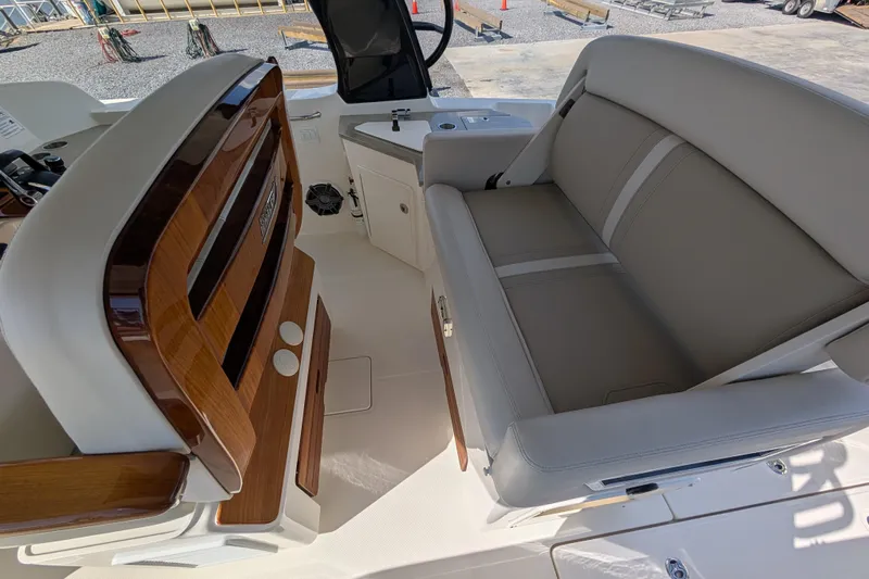  Yacht Photos Pics 2024 Boston Whaler 350 Realm interior with luxurious seating and wood accents.
