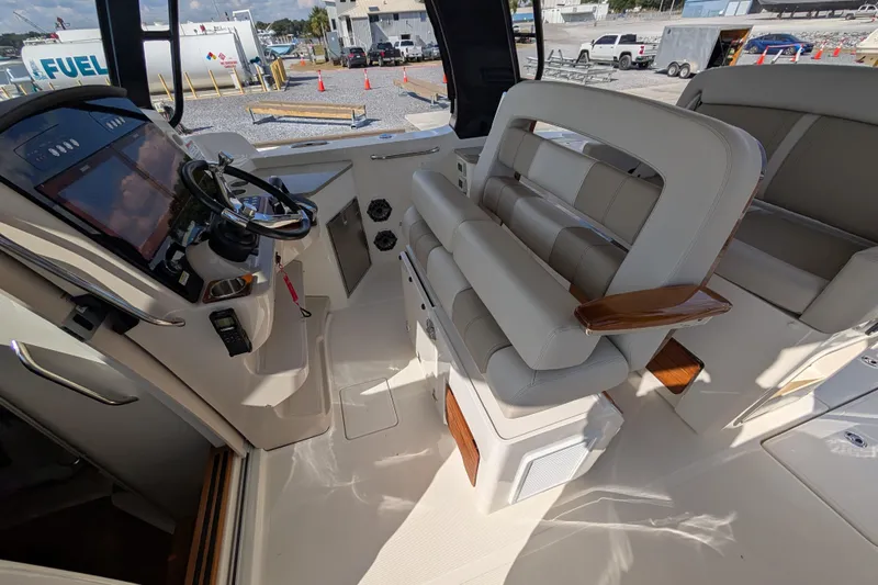  Yacht Photos Pics 2024 Boston Whaler 350 Realm helm with luxurious seating and modern controls.