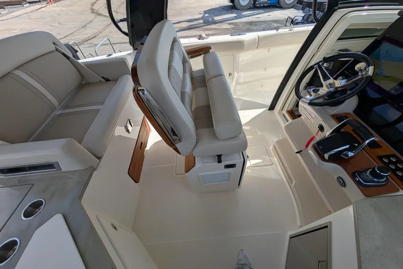  Yacht Photos Pics 2024 Boston Whaler 350 Realm helm with luxurious seating and modern controls.