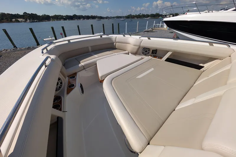 Yacht Photos Pics 2024 Boston Whaler 350 Realm boat interior with luxurious seating and waterfront view.