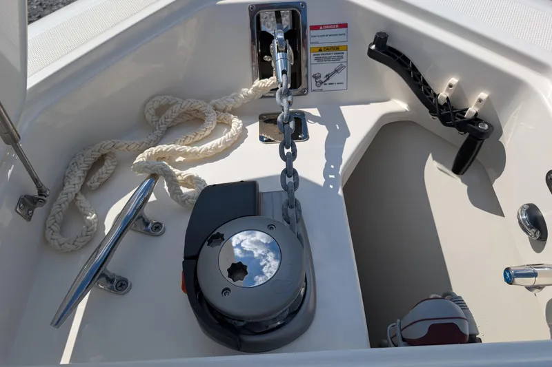  Yacht Photos Pics 2024 Boston Whaler 350 Realm anchor system with chain and rope in boat compartment.