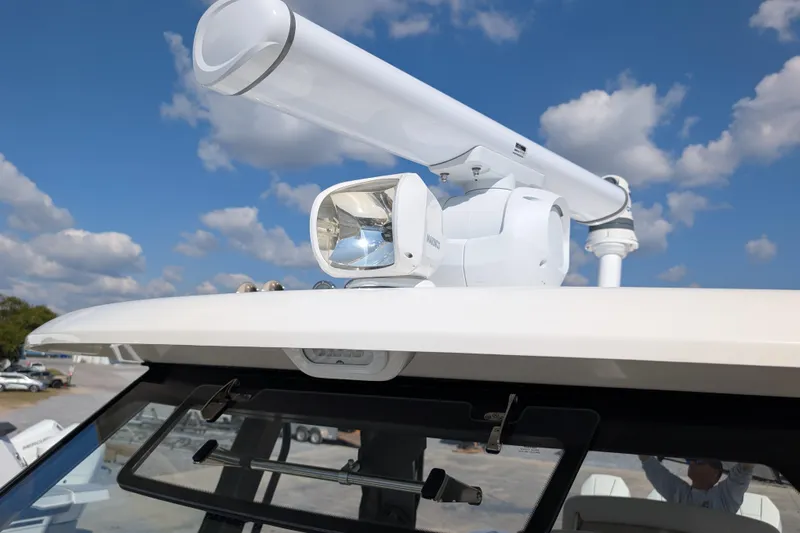  Yacht Photos Pics 2024 Boston Whaler 350 Realm radar and spotlight against a blue sky.