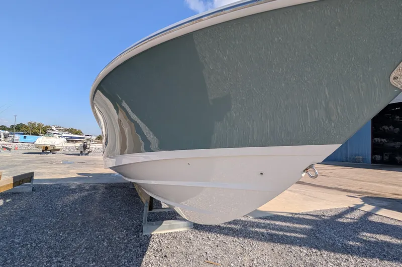  Yacht Photos Pics 2024 Boston Whaler 350 Realm boat hull on display outdoors.