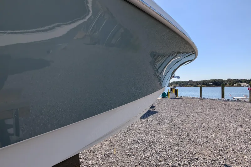  Yacht Photos Pics 2024 Boston Whaler 350 Realm boat hull by the waterfront.