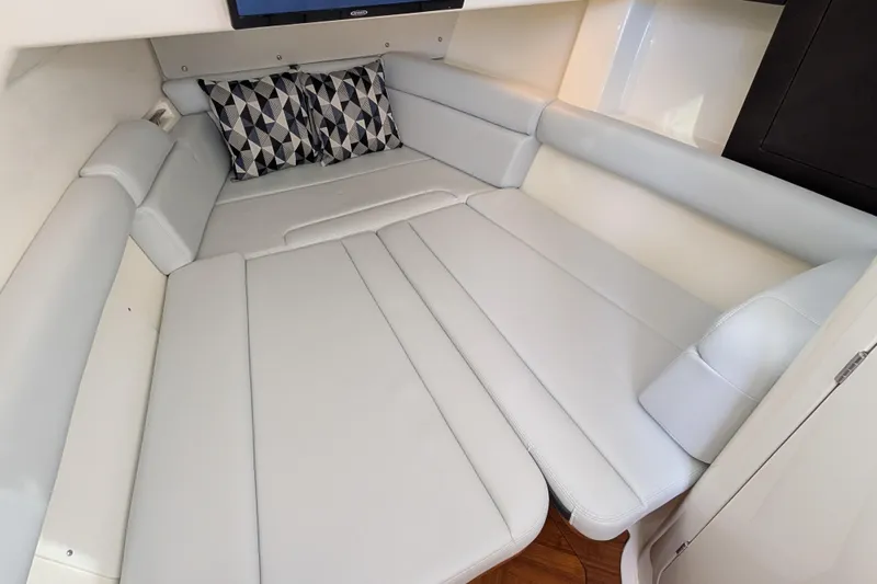  Yacht Photos Pics Luxurious interior cabin of 2024 Boston Whaler 350 Realm with plush seating and geometric pillows.