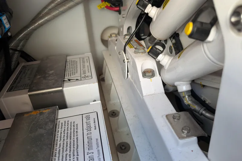  Yacht Photos Pics Engine compartment of 2024 Boston Whaler 350 Realm, showcasing mechanical components and wiring.