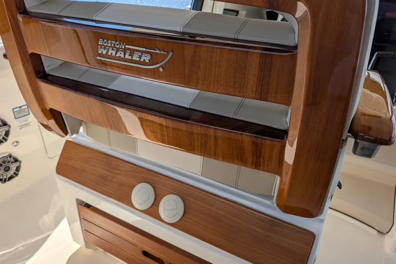  Yacht Photos Pics 2024 Boston Whaler 350 Realm interior with polished wood and branded detailing.