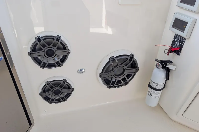  Yacht Photos Pics 2024 Boston Whaler 350 Realm interior with speakers and fire extinguisher.