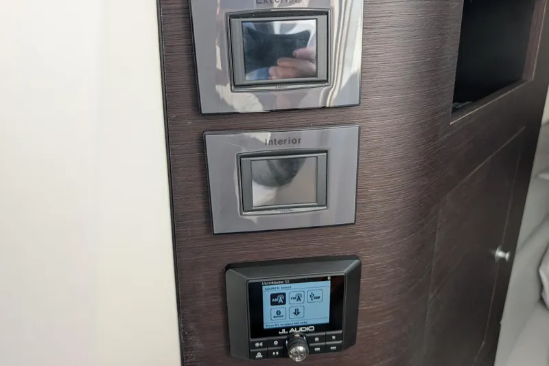  Yacht Photos Pics Control panel on 2024 Boston Whaler 350 Realm boat, featuring JL Audio system.