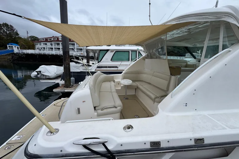  Yacht Photos Pics 2008 Tiara Yachts 3900 Sovran docked, featuring spacious seating and canopy.