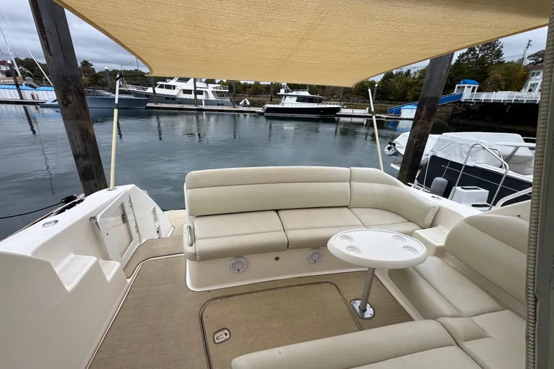  Yacht Photos Pics 2008 Tiara Yachts 3900 Sovran with beige seating and table, docked at marina.