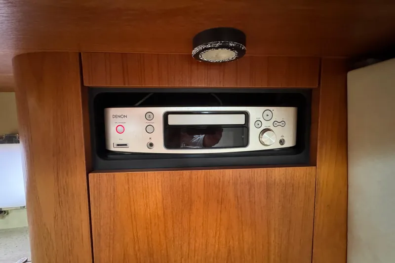  Yacht Photos Pics Denon audio system in 2008 Tiara Yachts 3900 Sovran interior, wooden paneling.