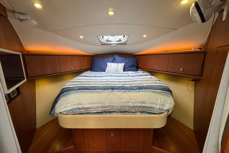  Yacht Photos Pics Luxurious cabin interior of 2008 Tiara Yachts 3900 Sovran with cozy bed and ambient lighting.