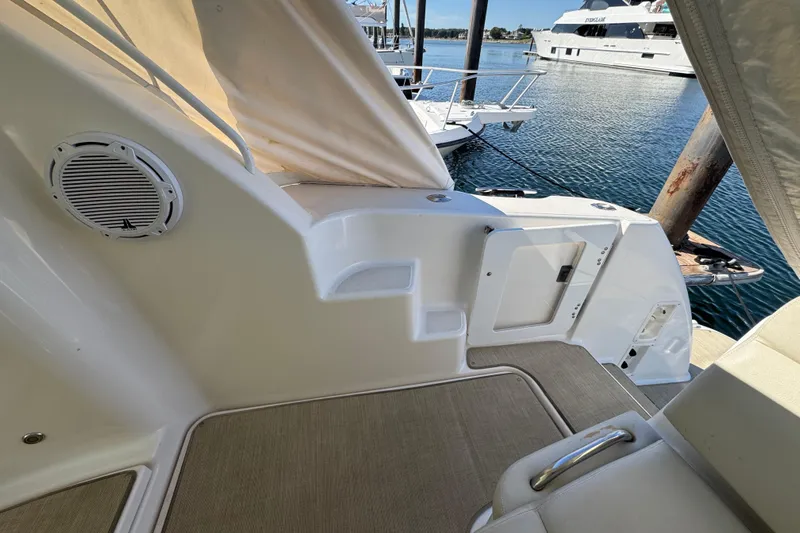  Yacht Photos Pics 2008 Tiara Yachts 3900 Sovran interior, featuring seating and speaker, docked by the water.