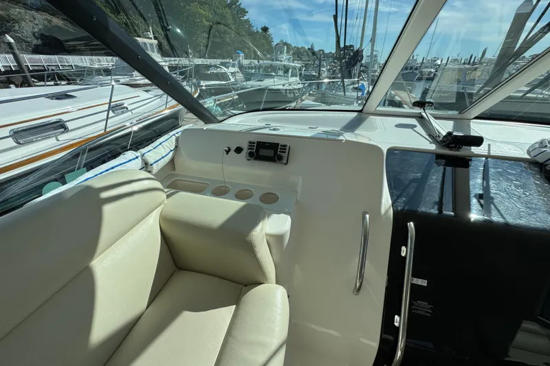  Yacht Photos Pics 2008 Tiara Yachts 3900 Sovran cockpit with beige seating and marina view.