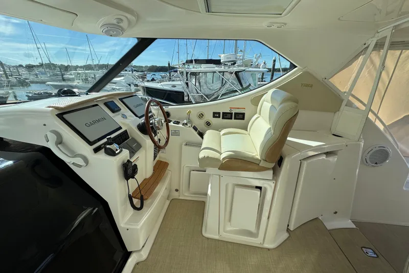  Yacht Photos Pics 2008 Tiara Yachts 3900 Sovran helm with Garmin navigation, luxurious seating, and marina view.