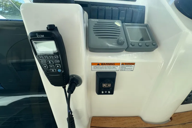  Yacht Photos Pics 2008 Tiara Yachts 3900 Sovran dashboard with Icom radio and navigation controls.