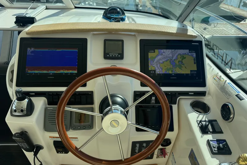  Yacht Photos Pics 2008 Tiara Yachts 3900 Sovran helm with dual Garmin displays and wooden steering wheel.
