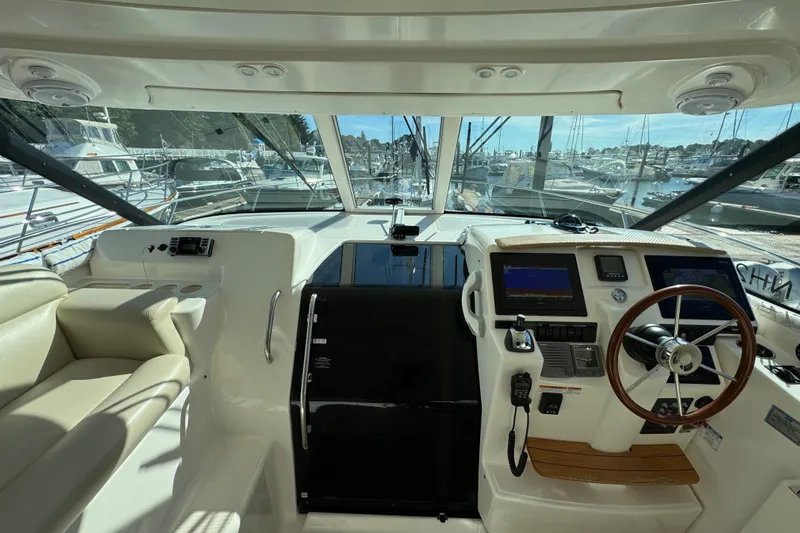  Yacht Photos Pics 2008 Tiara Yachts 3900 Sovran helm with steering wheel and navigation displays.