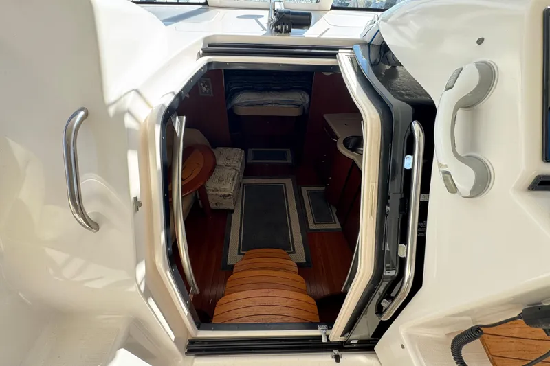  Yacht Photos Pics 2008 Tiara Yachts 3900 Sovran cabin entrance with wooden steps and interior view.