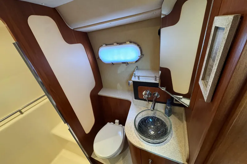  Yacht Photos Pics Luxurious 2008 Tiara Yachts 3900 Sovran bathroom with modern fixtures and porthole window.