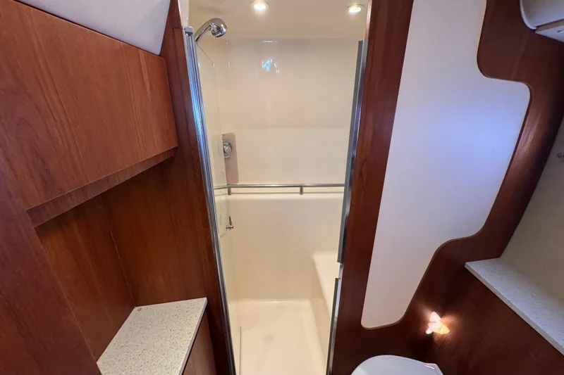  Yacht Photos Pics 2008 Tiara Yachts 3900 Sovran bathroom with wood accents and modern shower.