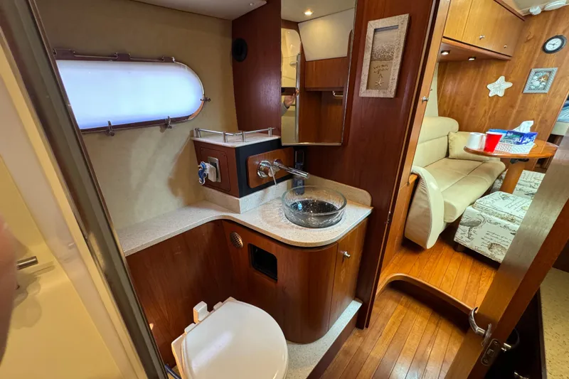  Yacht Photos Pics 2008 Tiara Yachts 3900 Sovran interior with bathroom and cozy seating area.