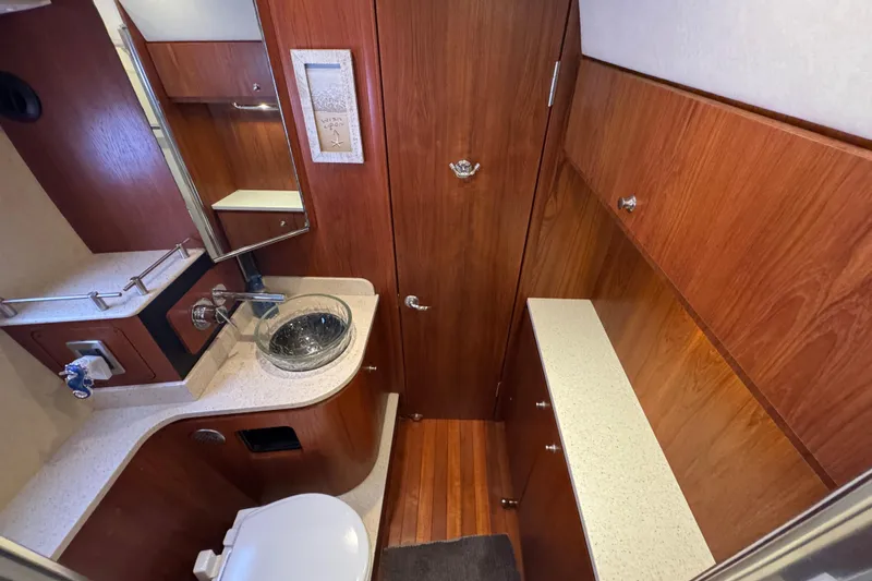  Yacht Photos Pics Luxurious 2008 Tiara Yachts 3900 Sovran bathroom with wood cabinetry and modern fixtures.