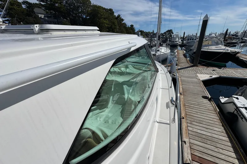  Yacht Photos Pics 2008 Tiara Yachts 3900 Sovran docked at marina, showcasing sleek design and windows.