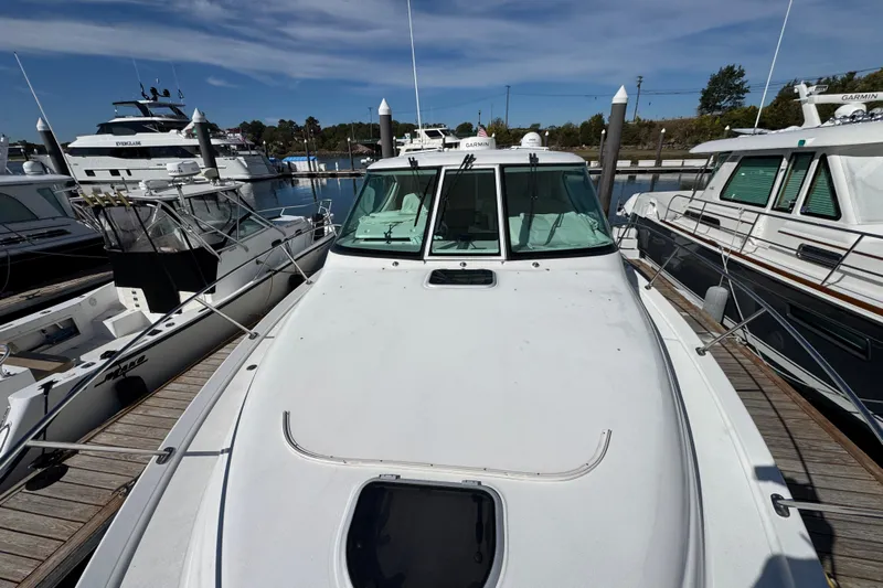  Yacht Photos Pics 2008 Tiara Yachts 3900 Sovran docked at marina, surrounded by other boats.