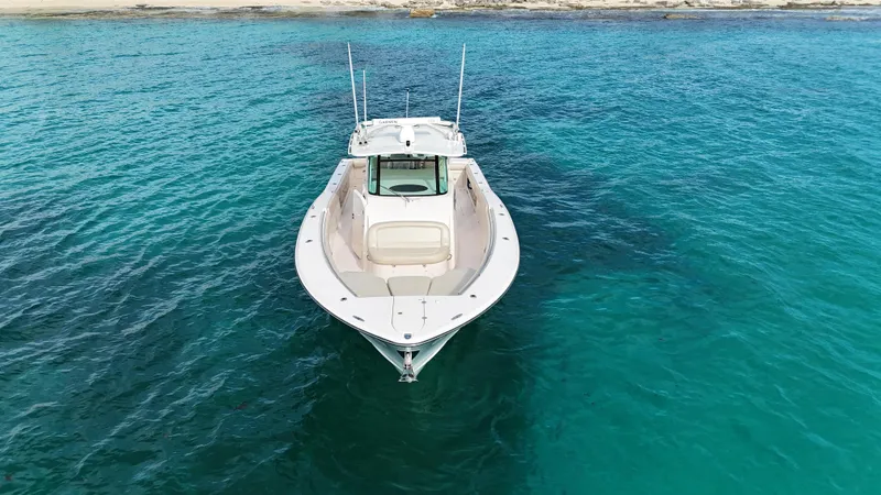  Yacht Photos Pics Grady-White Canyon 366 boat on clear blue water, 2013 model.