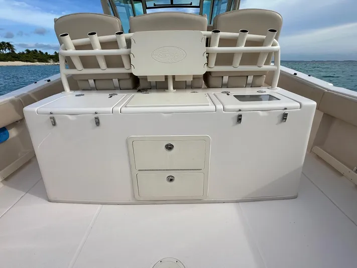  Yacht Photos Pics 2013 Grady-White Canyon 366 boat interior with storage compartments and seating.