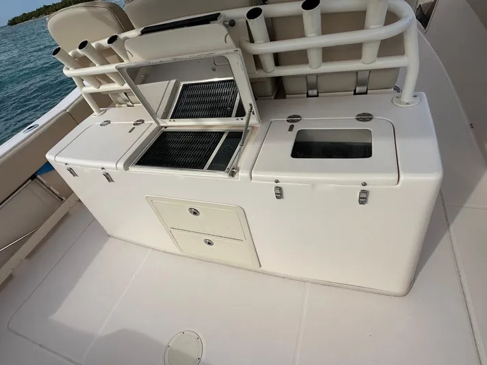  Yacht Photos Pics 2013 Grady-White Canyon 366 boat deck with storage and fishing station.