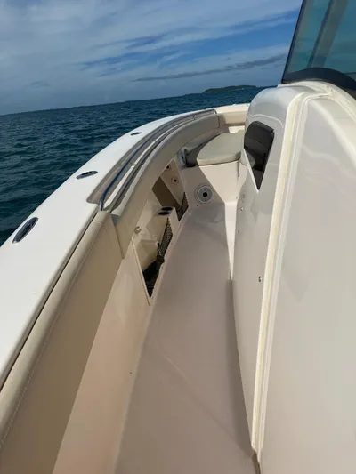  Yacht Photos Pics 2013 Grady-White Canyon 366 boat on open water, showcasing sleek deck design.