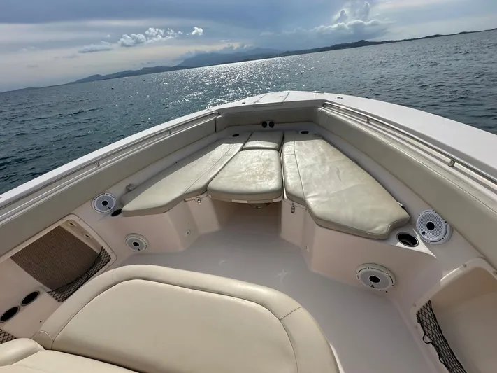  Yacht Photos Pics 2013 Grady-White Canyon 366 boat interior with cushioned seating on open water.