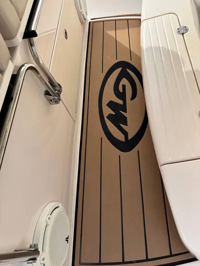  Yacht Photos Pics 2013 Grady-White Canyon 366 boat deck with logo and seating area.