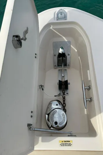  Yacht Photos Pics Anchor compartment of 2013 Grady-White Canyon 366 boat, featuring winch and chain.