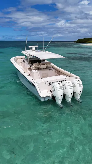  Yacht Photos Pics 2013 Grady-White Canyon 366 boat with triple engines on turquoise water.