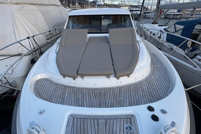 Annie Yacht Photos Pics 2023 Nimbus 405 Coup&eacute; yacht with sunbathing deck, docked in marina.