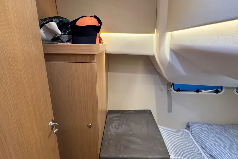 Annie Yacht Photos Pics Interior cabin of 2023 Nimbus 405 Coup&eacute; with wooden cabinetry and seating.