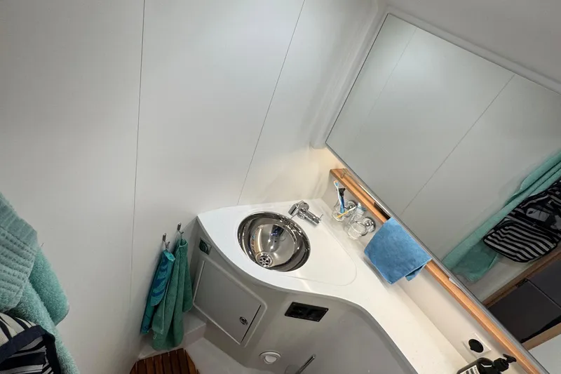 Annie Yacht Photos Pics Modern bathroom in 2023 Nimbus 405 Coup&eacute; yacht with sleek sink and mirror.