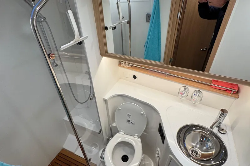 Annie Yacht Photos Pics Bathroom interior of 2023 Nimbus 405 Coup&eacute; with shower, toilet, and sink.