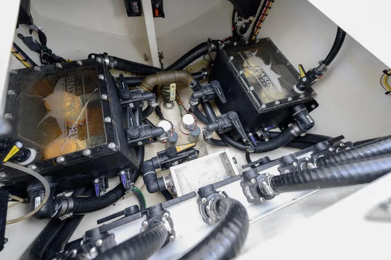  Yacht Photos Pics Engine compartment of 2023 SeaVee 420Z boat, showcasing dual engines and complex wiring.