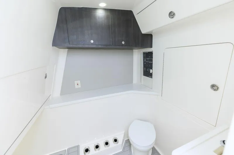  Yacht Photos Pics 2023 SeaVee 420Z boat interior with modern bathroom and storage cabinets.
