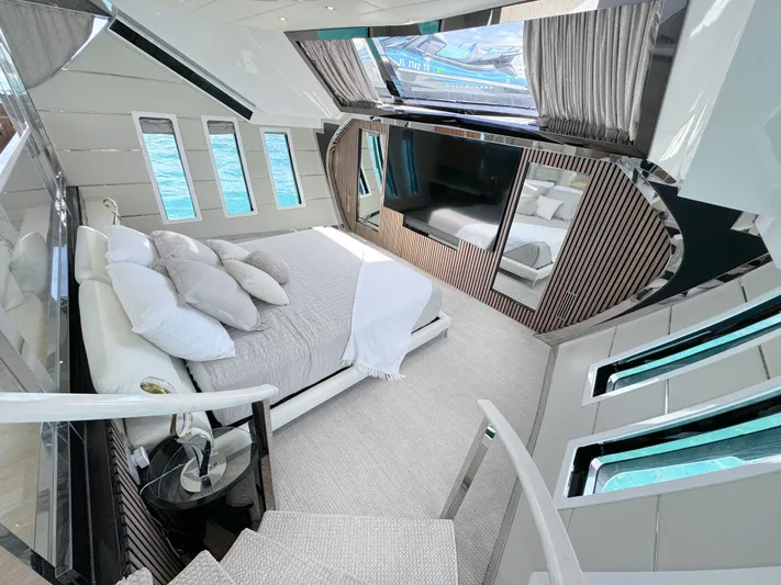  Yacht Photos Pics Luxurious bedroom interior of 2010 Custom WHS Marine yacht with panoramic windows and modern decor.