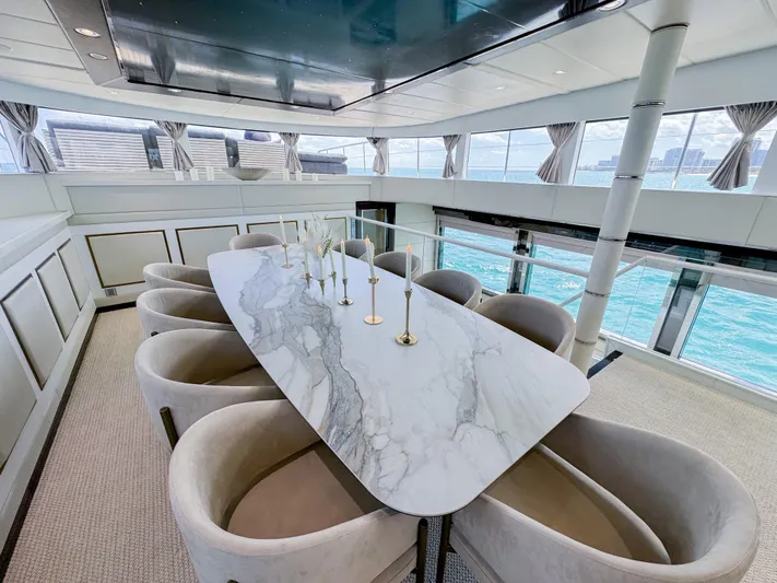  Yacht Photos Pics Luxurious dining area on a 2010 Custom WHS Marine yacht with ocean views.
