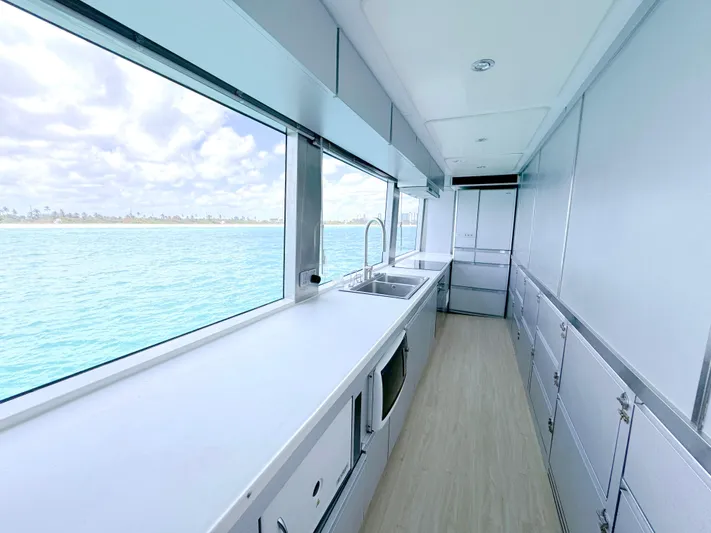  Yacht Photos Pics Modern kitchen interior on a 2010 Custom WHS Marine boat with ocean view.