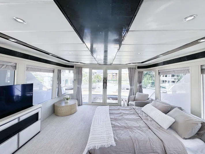  Yacht Photos Pics Luxurious bedroom interior of 2010 Custom WHS Marine yacht with large windows and modern decor.